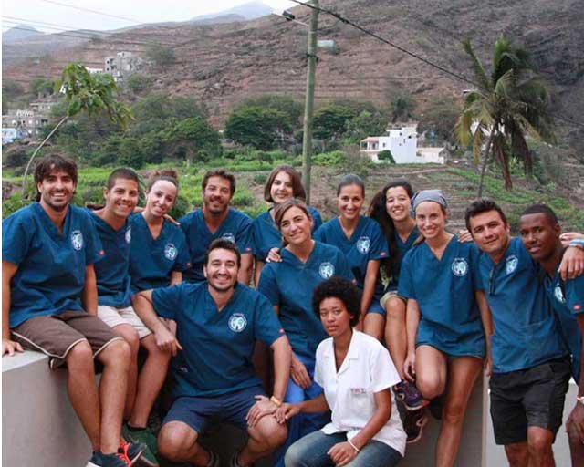 Dr. Heinz-Oliver Siebelist, founder of SMILES NGO in a group photo with other volunteers during one of the dental aid projects.